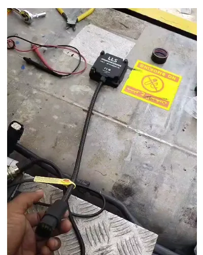 Omnicomm LLS capacitive fuel level sensor with braided cable and connector, prepared for installation on a truck tank